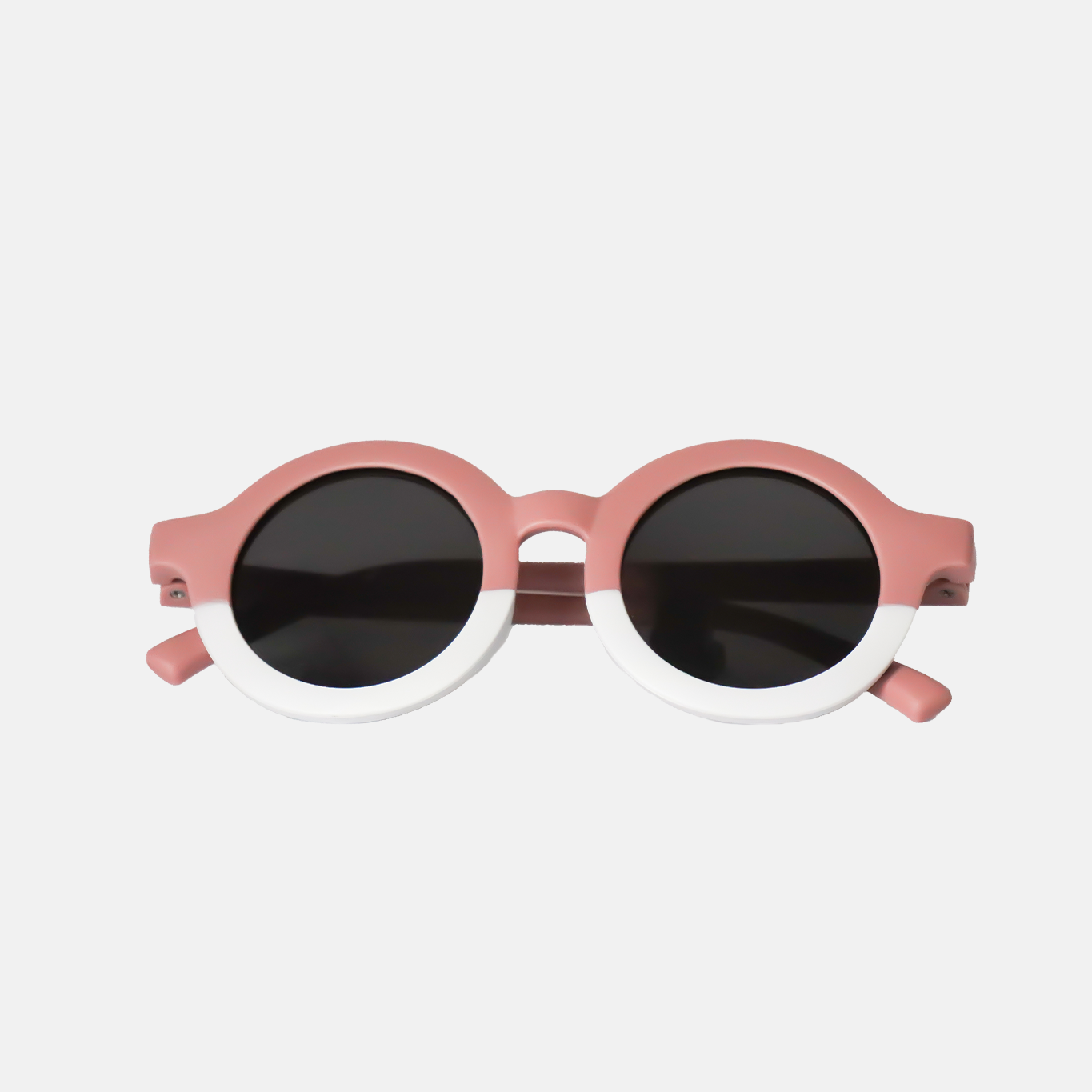 Lunettes de soleil bébé catégorie 3 Hop'Pop bicolores rose et blanc, verres ronds noirs haute protection anti-UV, idéales pour forte luminosité.