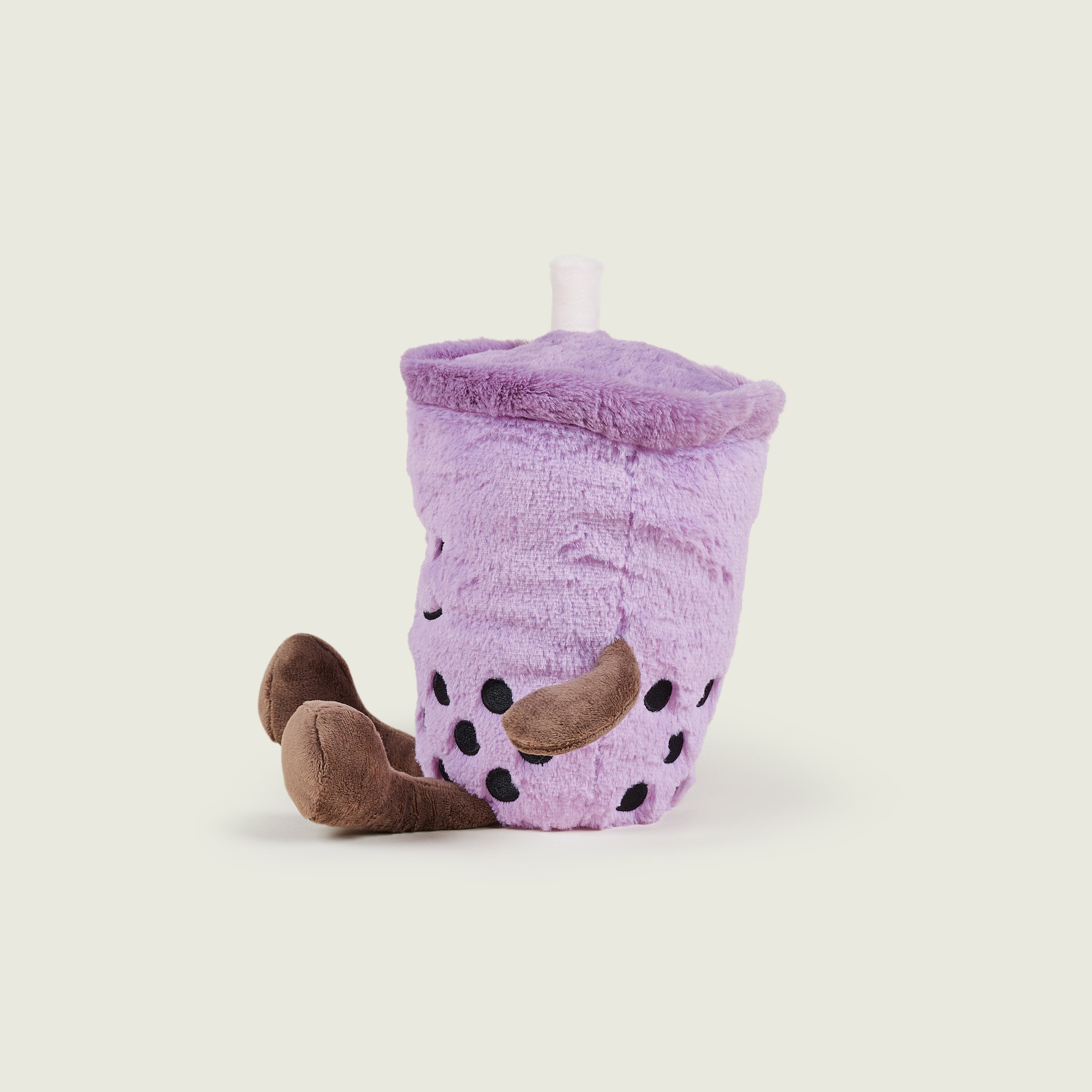 bouillotte bubble tea violet avec bras et jambes marron de profils gauche