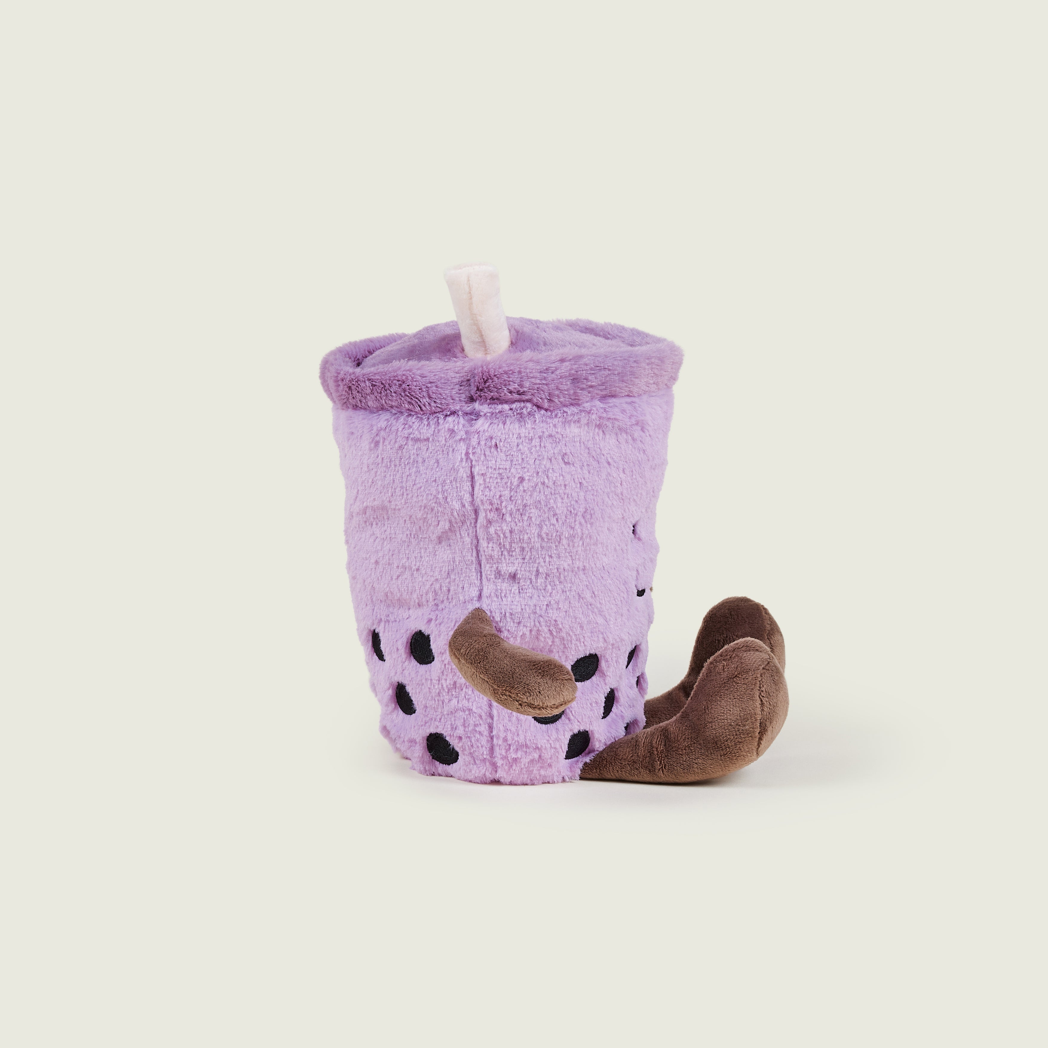 bouillotte bubble tea violet avec bras et jambes marron sur le profil droit