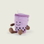 bouillotte bubble tea violet avec bras et jambes marron et visage avec un sourire 