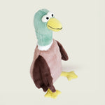 Bouillotte peluche en forme de canard de la marque Warmies, vu de profil, avec une tête verte, un bec jaune et un corps marron 