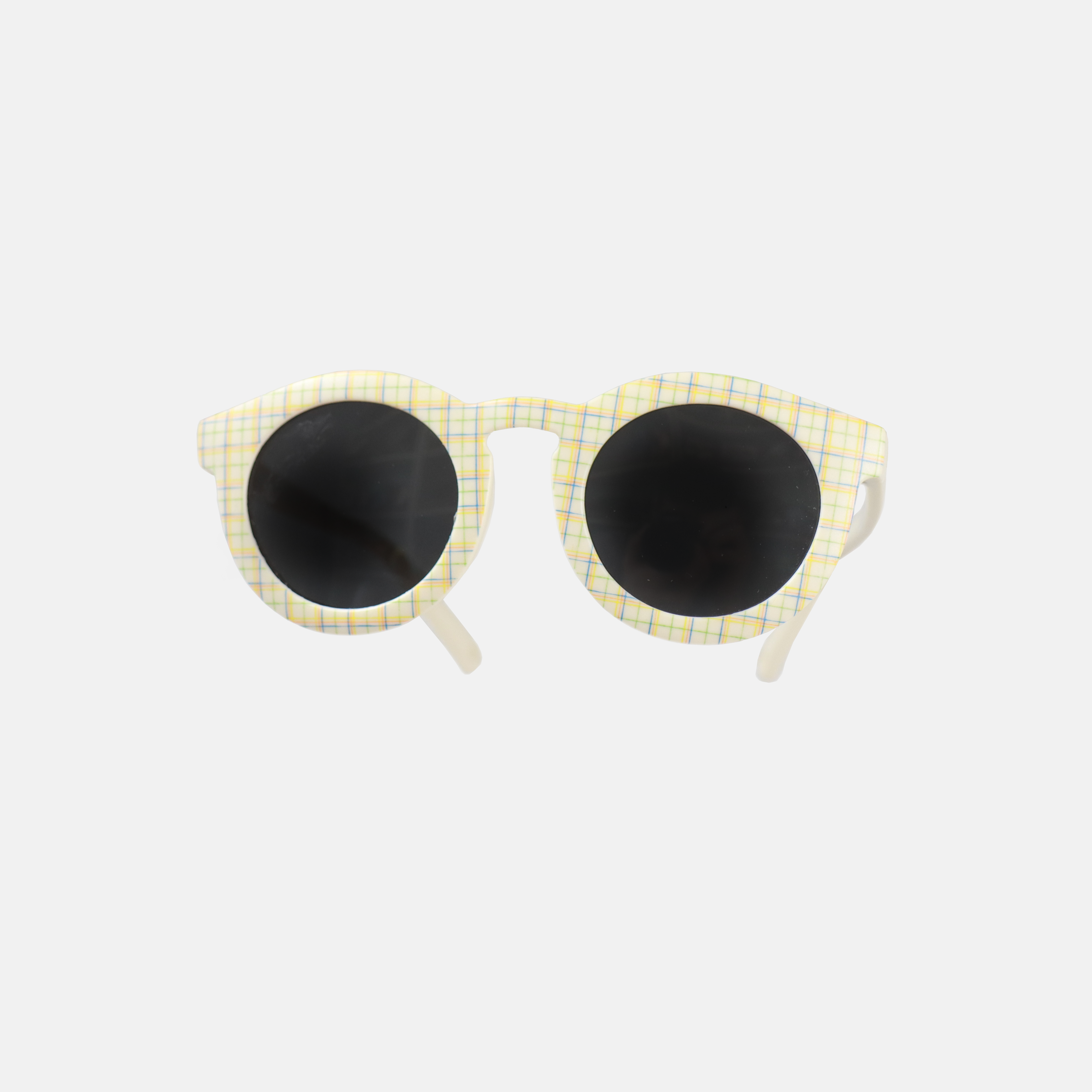 Lunettes de soleil pour adulte avec monture ronde à motif tartan, branches souples créme, et verres noirs polarisés – modèle Hop'Pop CAT3, conçu pour une haute protection anti-UV.