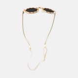 Lunettes de soleil pour enfants avec monture ronde à motif rayée rouge, branches souples crème, et verres noirs polarisés – modèle Hop'Pop CAT4, conçu pour une haute protection anti-UV.