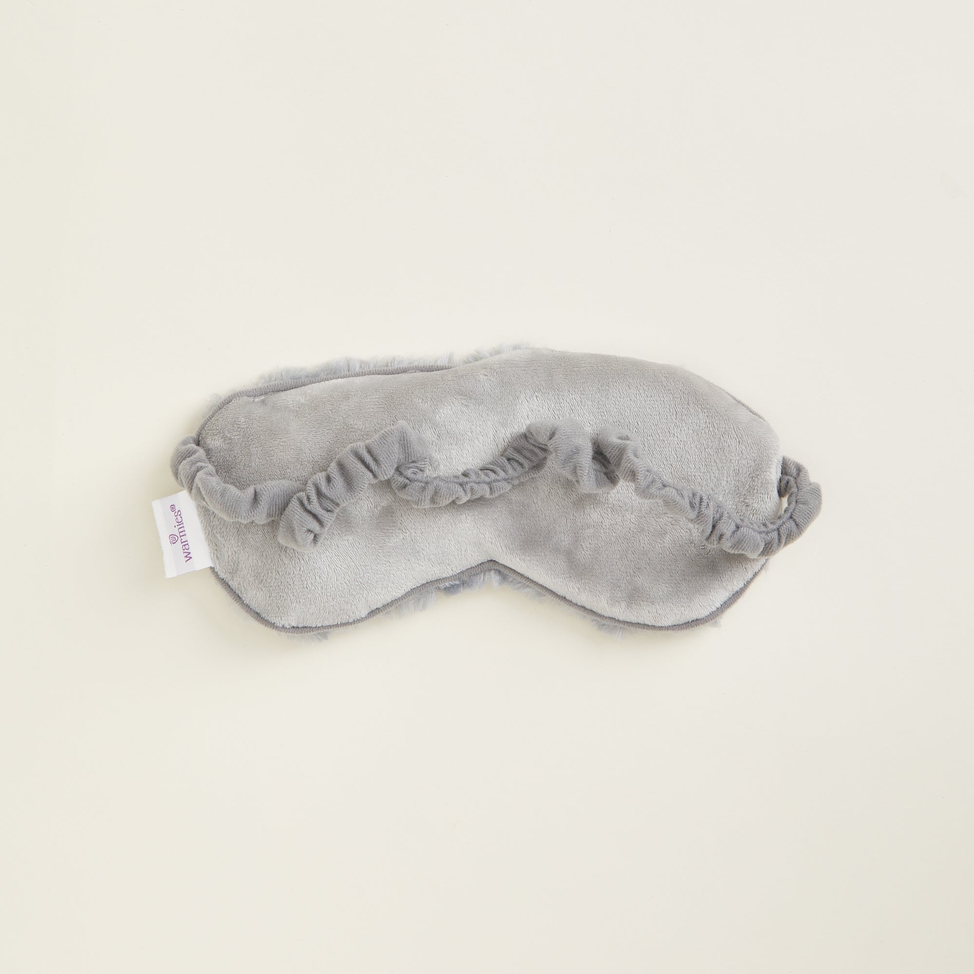 Vue arrière du masque Warmies avec bande élastique recouverte de tissu doux.